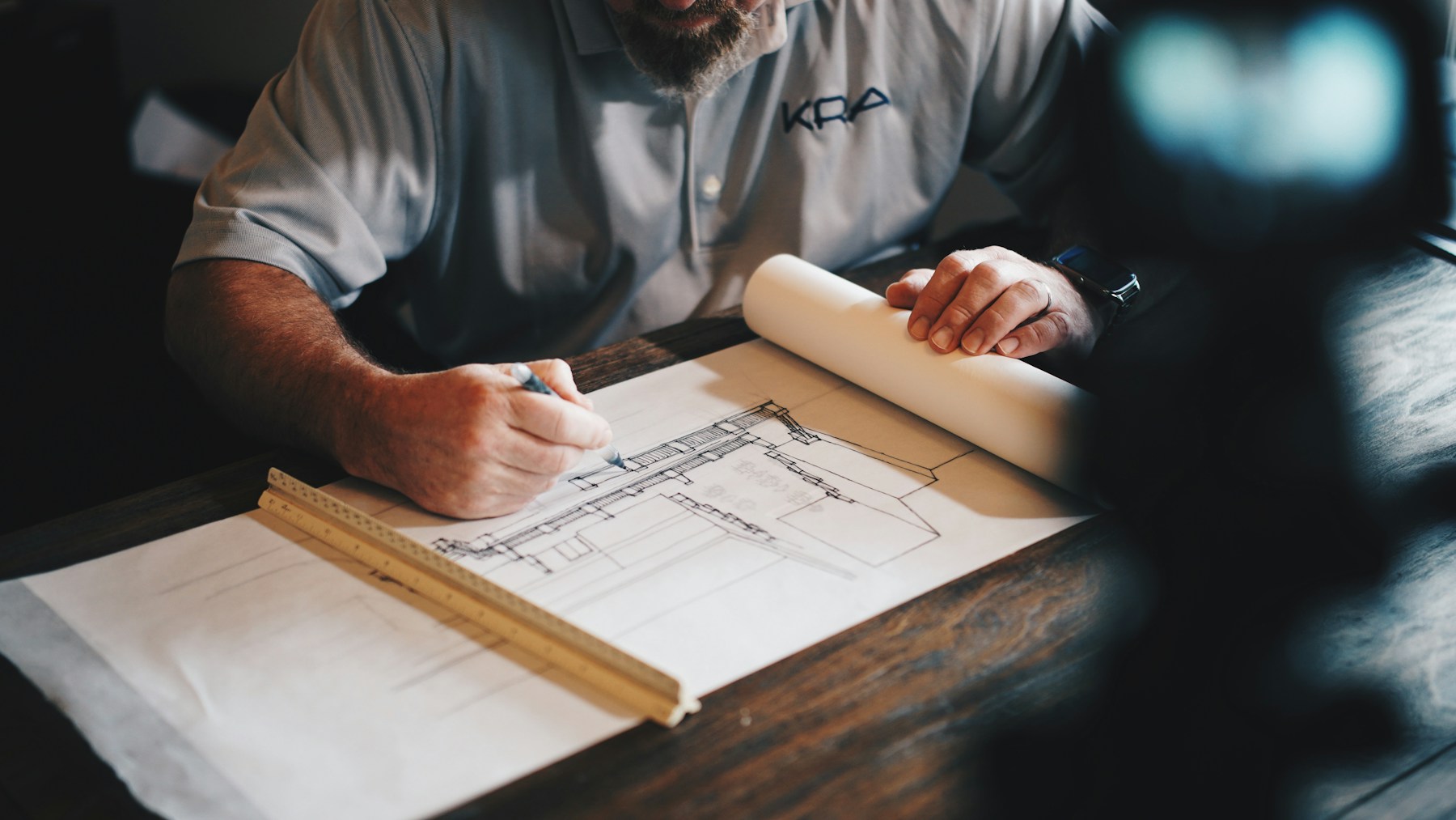 Architect working on a detailed construction plan
